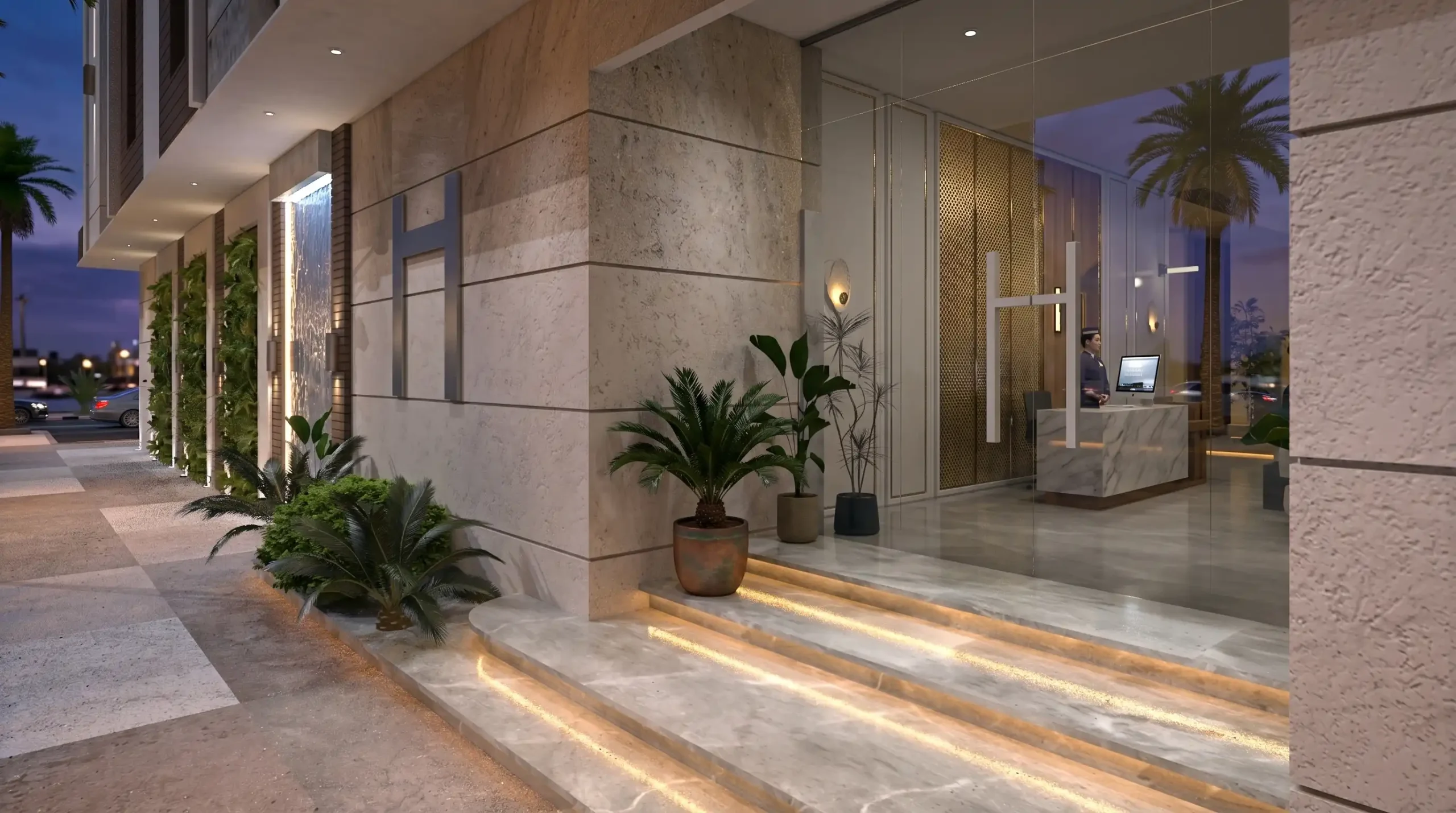 Residential Building Facade Design in Saudi Arabia: A Practical Guide | Kenania Inventive Arts Residential entrance in pale beige cladding with a lit water feature panel, green wall panels, illuminated step nosings and a reception desk visible through the glass doors