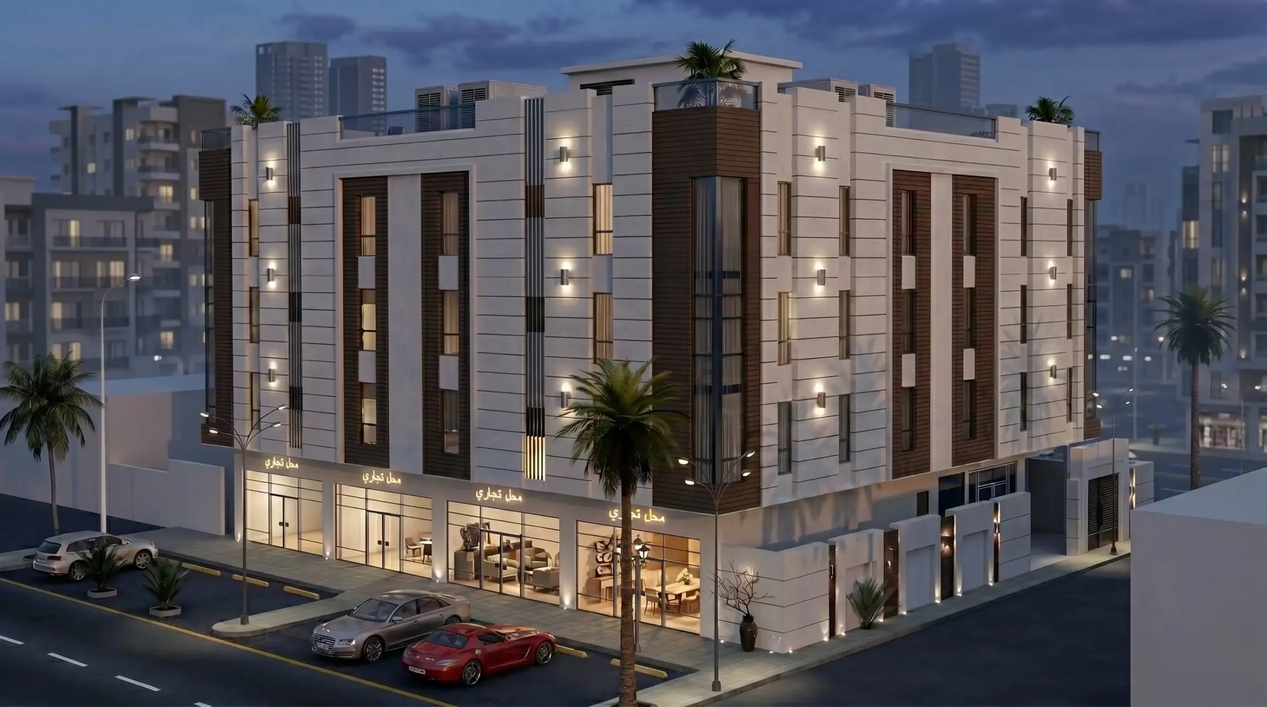 Residential Building Facade Design in Saudi Arabia: A Practical Guide | Kenania Inventive Arts Elevated corner view of the Jeddah residential building at dusk with lit retail units and Arabic shopfront signs at street level, a glazed vertical element wrapping the corner and roof equipment visible above the parapet
