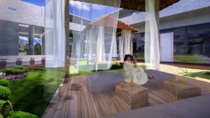 Open-air spa cabana with white drapes and a timber deck on a lawn, a low carved table and a guest in a robe seated on cushions