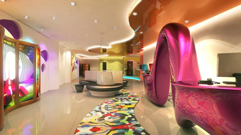Creative Agency Office: A Ribbon Desk, Organic Walls and Colour That Does the Wayfinding | Kenania Inventive Arts Creative agency office: magenta ribbon desk, curved feature wall and patterned carpet under a lit ceiling