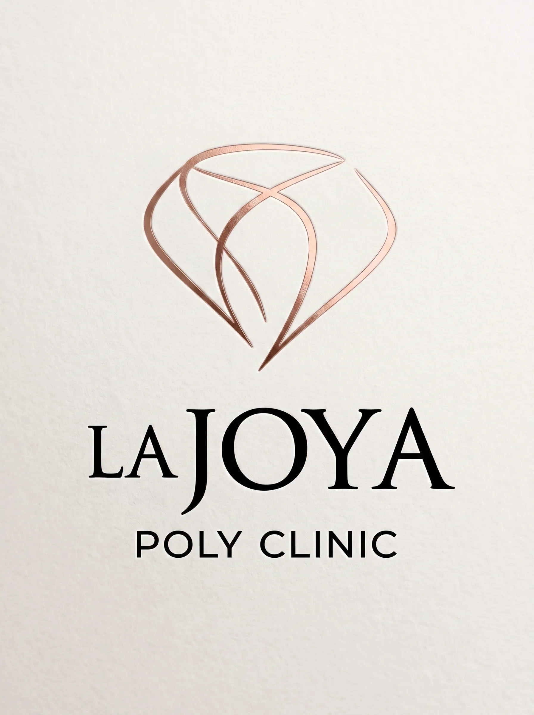 La Joya Poly Clinic logo in rose gold foil on textured paper