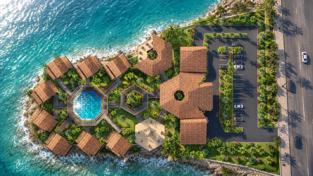 Top-down view of the villa cluster on its rocky headland: villas in a ring around the pool, the clubhouse and parking by the coast road