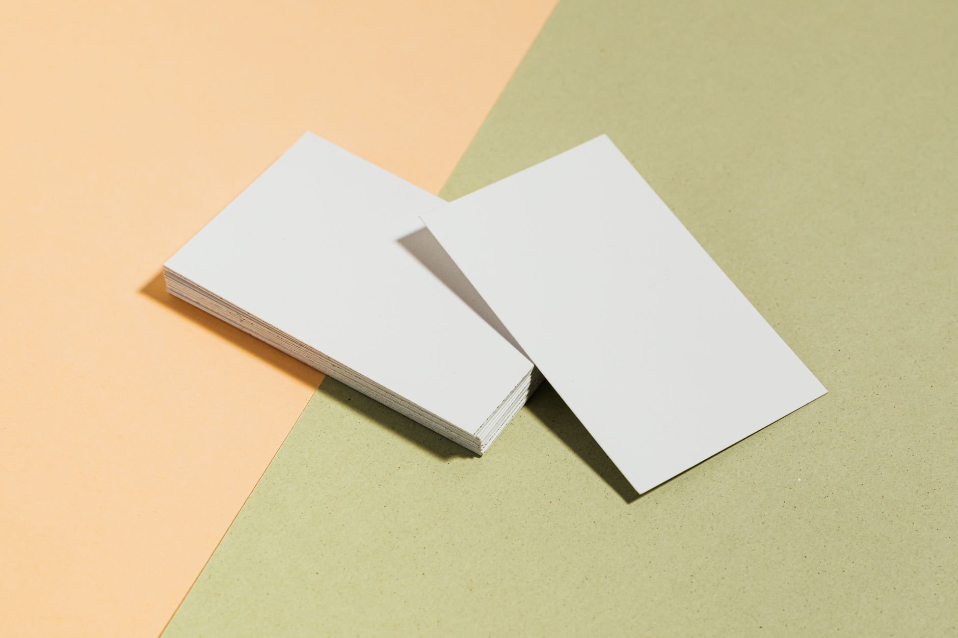 Blank business cards on coloured paper stock, ready for a stationery design