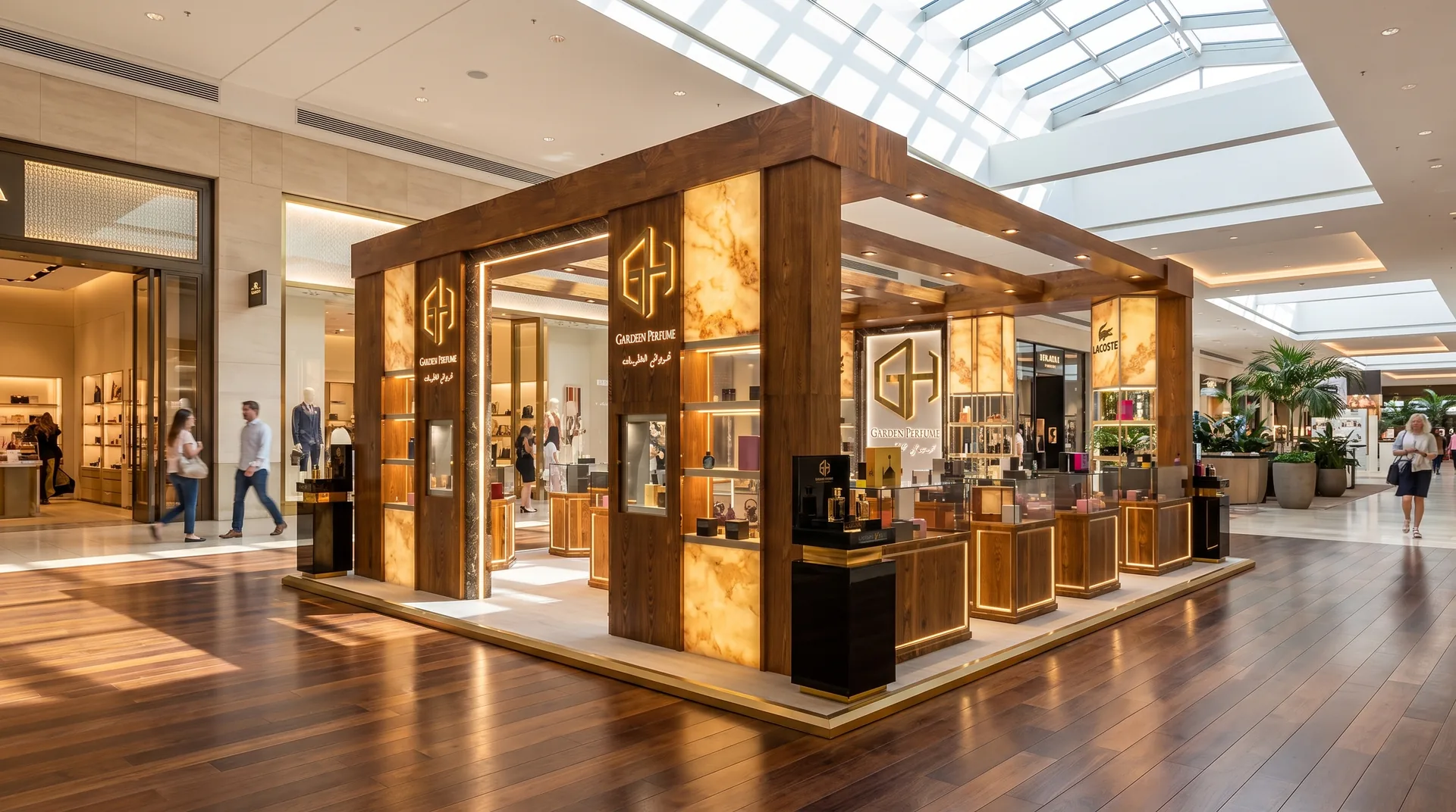 كشك غريواتي للعطور، دبي: وحدة جزيرة بروح البوتيك لعلامة عطور جديدة | Kenania Inventive Arts Ghreiwati Perfumes island kiosk: dark timber frame and backlit onyx panels under a mall skylight